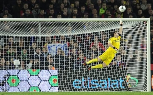 Iker Casillas flying in a football save for Real Madrid in 2012