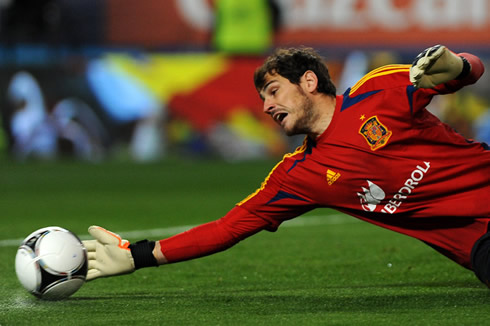 Iker Casillas making a right hand save for Spain