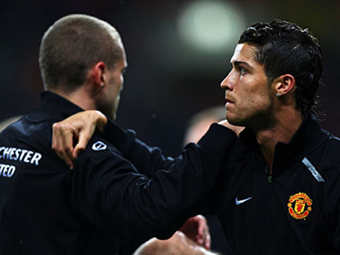 Cristiano Ronaldo and Nemanja Vidic warming up before a Manchester United game