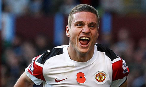 Nemanja Vidic celebrating a goal for Manchester United in a white jersey