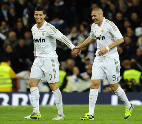 Cristiano Ronaldo and Karim Benzema giving hands in Real Madrid, in 2012