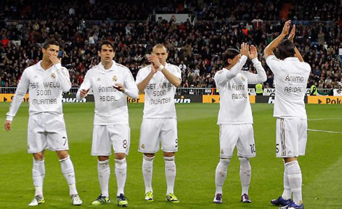 Cristiano Ronaldo and Real Madrid players wearing shirts with shirts with encouraging messages to Barcelona's Eric Abidal and Bolton's Fabrice Muamba, in 2012