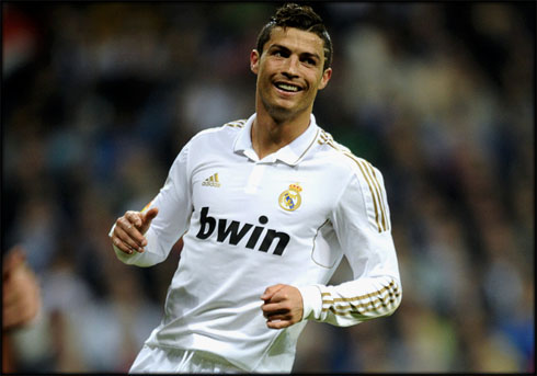 Cristiano Ronaldo big simle as he helps Real Madrid restoring the lead over Barcelona in La Liga 2012