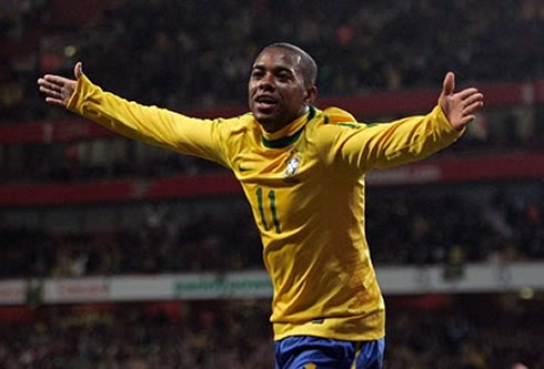 Robinho opening his arms to celebrate a goal for Brazil in 2012