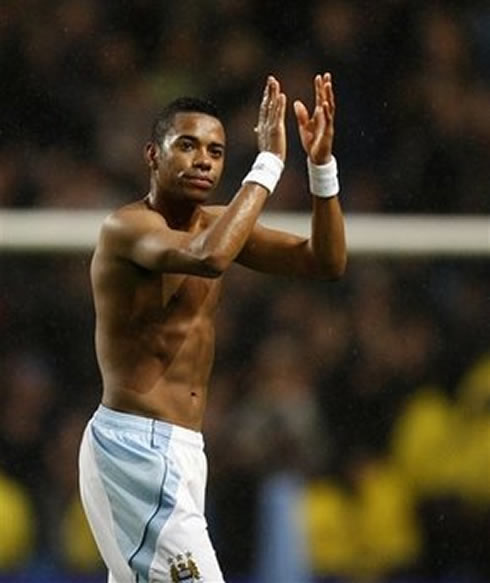 Robinho shirtless, showing his abs and six-pack