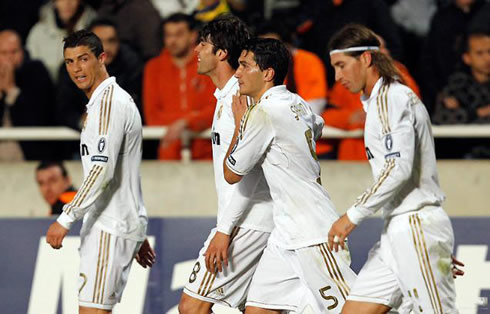 Cristiano Ronaldo, Kaká, Nuri Sahin and Sergio Ramos, walking back to their side, after a Real Madrid goal in 2012