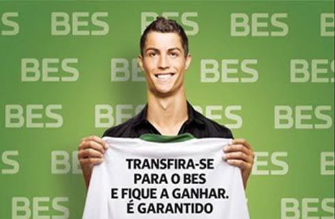 Cristiano Ronaldo holding a BES promotional message on a shirt