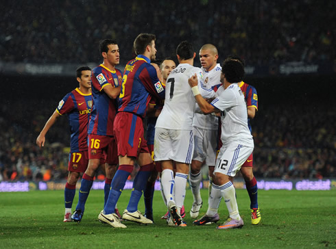 Cristiano Ronaldo fighting with Barcelona players in the Clasico