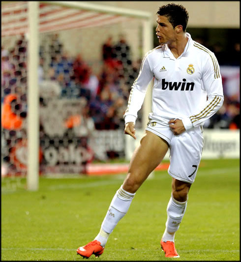 Cristiano Ronaldo showing his right leg thighs muscles, after scoring a goal in Atletico Madrid vs Real Madrid, for La Liga 2012