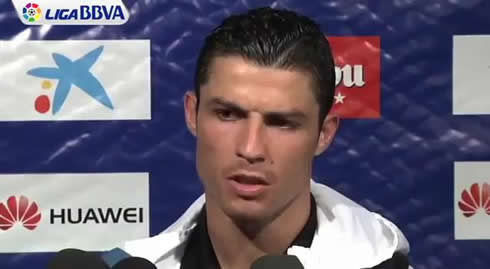 Cristiano Ronaldo frowning his eye brows and showing his disagreement during an interview in 2012, with a small wart and mole on his face