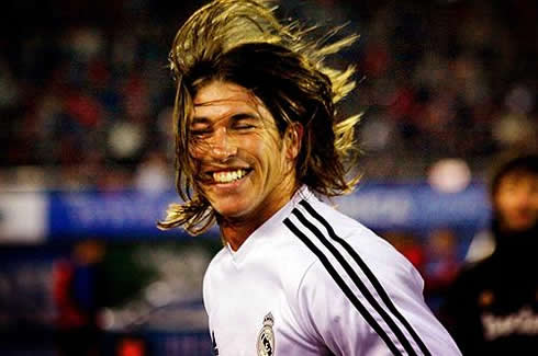 Sergio Ramos long and blonde hair, waving in the air