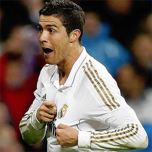 Cristiano Ronaldo showing his love for Real Madrid, when celebrating a goal and pointing at the club symbol and badge on his jersey, in 2012