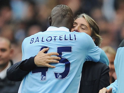 Mario Balotelli celebrating goal by hugging Roberto Mancini, in Manchester City 2012