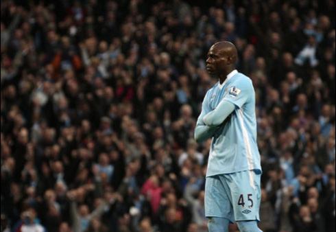 Mario Balotelli goal celebration for Manchester City, staring the crowd and crossing his arms