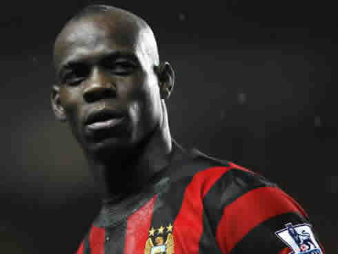 Mario Balotelli in Manchester City black and red stripes jersey