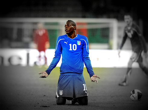 Mario Balotelli playing for the Italian National Team, and on his knees