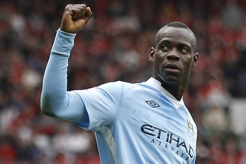Mario Balotelli raising his hand when celebrating a goal for Manchester City in 2012