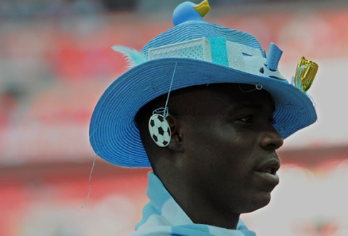 Mario Balotelli wearing a Manchester City funny and peculiar hat