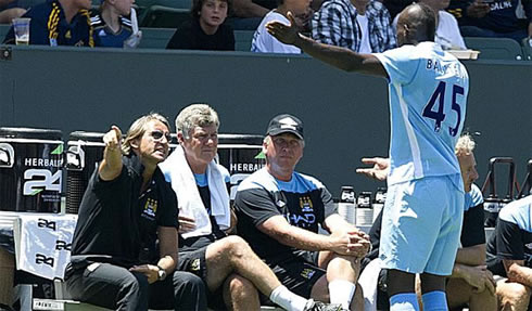 Roberto Mancini furious with Mario Balotelli, after a childish act, in a soccer game for Manchester City, in the 2011-2012 pre-season