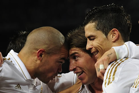 Cristiano Ronaldo blinking his eye an Pepe touching heads with Sergio Ramos, in Real Madrid goal celebrations against Barcelona, in 2012