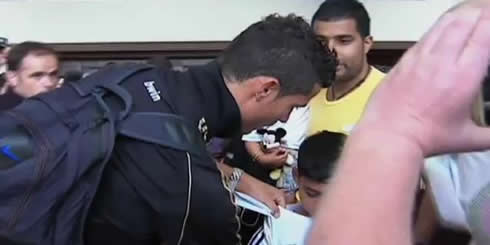 Cristiano Ronaldo signing an autograph to a young Real Madrid fan, still a kid