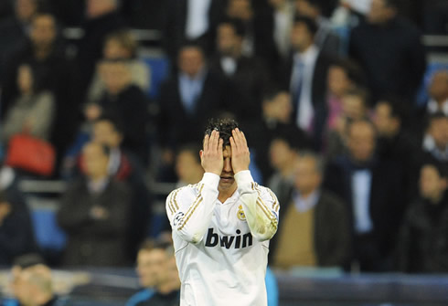 Cristiano Ronaldo hiding his face with his hands while crying, in Real Madrid vs Bayern Munich for the UEFA Champions League in 2012