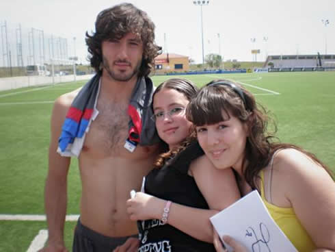 Esteban Granero shirtless, showing his chest and body few muscles, as well as his non existing abs, aside with two fans