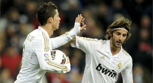 Cristiano Ronaldo touching hands with Esteban Granero, after a goal for Real Madrid in 2012