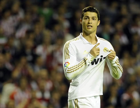 Cristiano Ronaldo pointing to Real Madrid's badge on his jersey, as a response to hostile Athletic Bilbao fans in the crowd, in 2012
