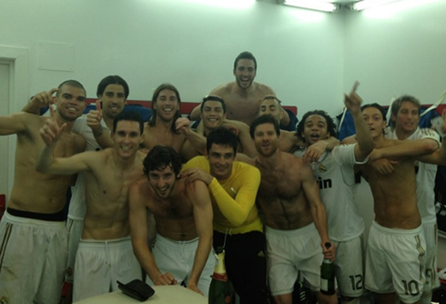Real Madrid soccer players shirtless, showing their chest and abs muscles, inside the locker rooms in 2012