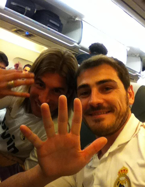 Iker Casillas and Sergio Ramos making a hand gesture in Real Madrid celebrations