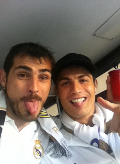 Iker Casillas putting his tongue out in a photo with Ronaldo in 2012