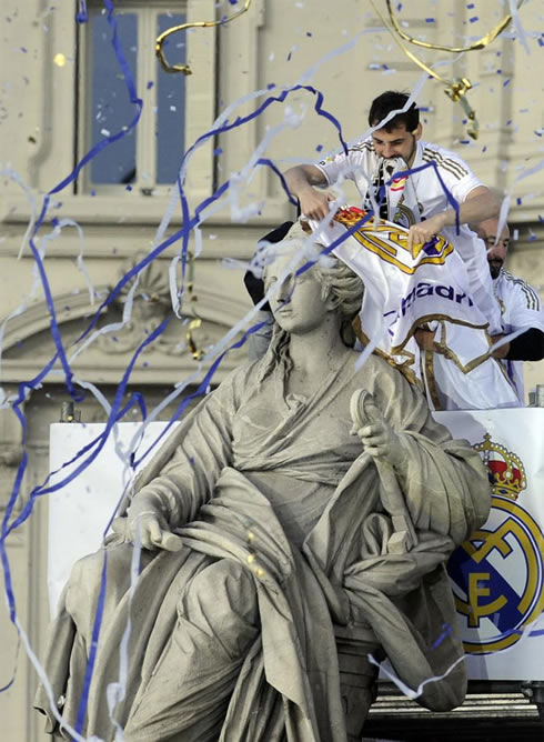 Real Madrid captain and goalkeeper, Iker Casillas, dressing the Cibeles statue with a scarf, in La Liga celebrations in 2012