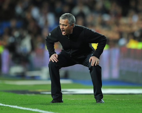 José Mourinho on a very weird position, as if he was in the toilet