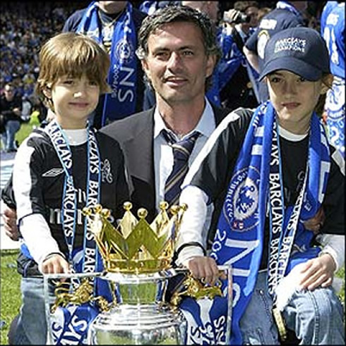 José Mourinho with his son, José Mário Jr and his daughter Matilde, taking a photo with the Enlgish Premier League trophy just won for Chelsea FC