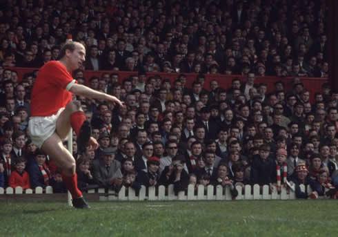 Sir Bobby Charlton making a cross in a game for Manchester United, in the 60's or 70's