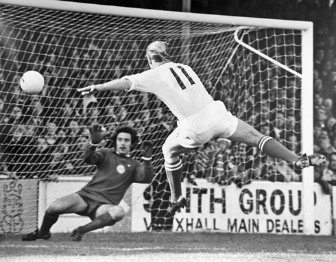 Bobby Charlton scoring a goal for Manchester United