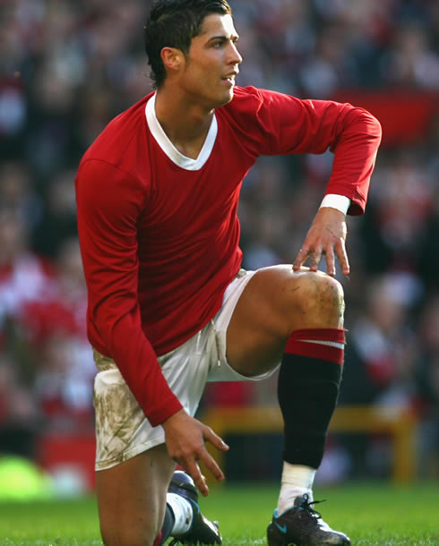 Cristiano Ronaldo playing a Manchester United game in tribute to the Busby Babes, in a plain red shirt/jersey