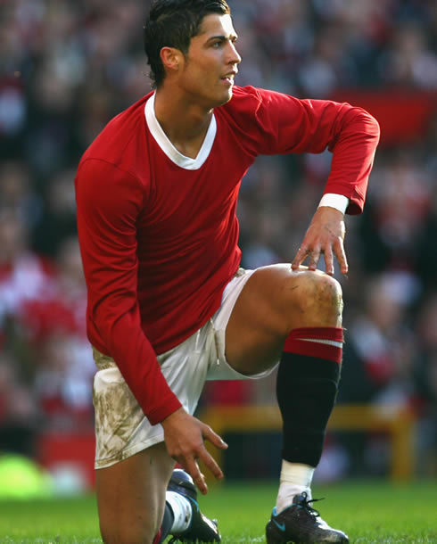 Cristiano Ronaldo playing a Manchester United game in tribute to the Busby Babes, in a plain red shirt/jersey