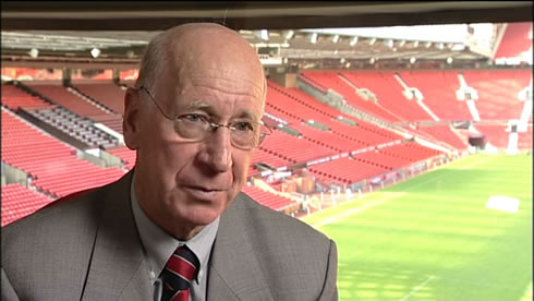 Sir Bobby Charlton granting an interview, with the Old Trafford stadium as a scenario