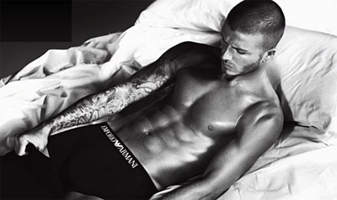 David Beckham in Armani photoshoot, naked and shirtless, contracting his six pack abs