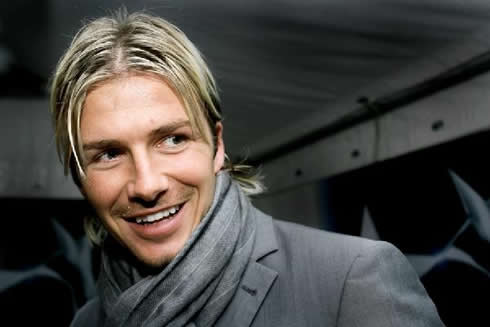 David Beckham smiling with his long and classic blonde hair