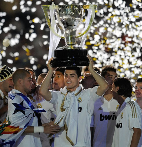 Cristiano Ronaldo holding La Liga trophy on the top of his head, in Real Madrid's La Liga celebrations, at the Santiago Bernabéu in 2012