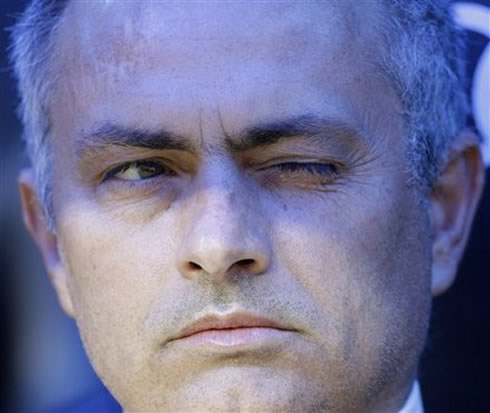 José Mourinho blinking/closing one eye, as a sign of confidence
