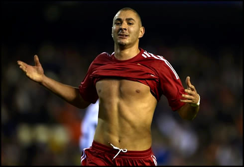 Karim Benzema pulling off his Real Madrid red jersey and showing his sexy abs, as well as his chest muscles while shirtless, in 2012