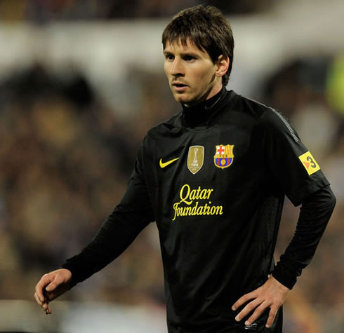 Lionel Messi in a Barcelona black jersey in 2012