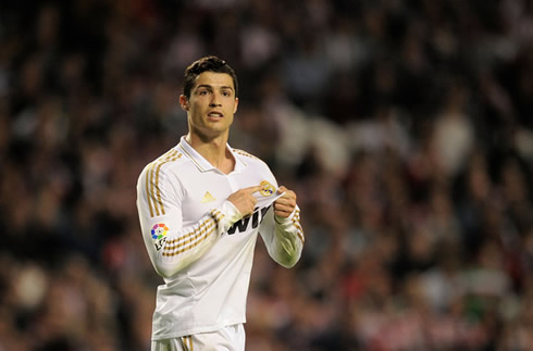 Cristiano Ronaldo's Real Madrid devotion, by pointing to the club's badge on his jersey