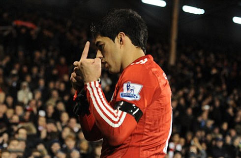 Luis Suárez rebel and Liverpool soccer player bad boy, showing the middle finger to Fulham fans, in 2011-2012