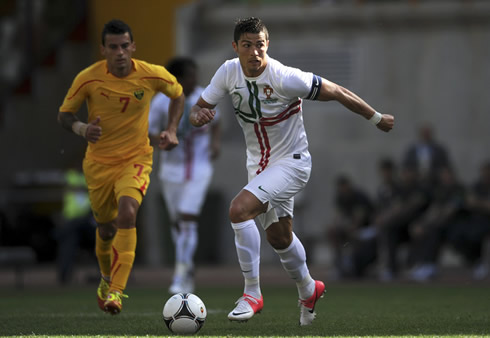 Cristiano Ronaldo running with the ball, in Portugal vs Macedonia in 2012, with the new Portuguese away kit/jersey and shirt