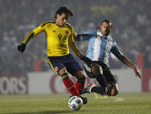 Radamel Falcao avoiding a sliding tackle from Javier Mascherano, in Colombia vs Argentina